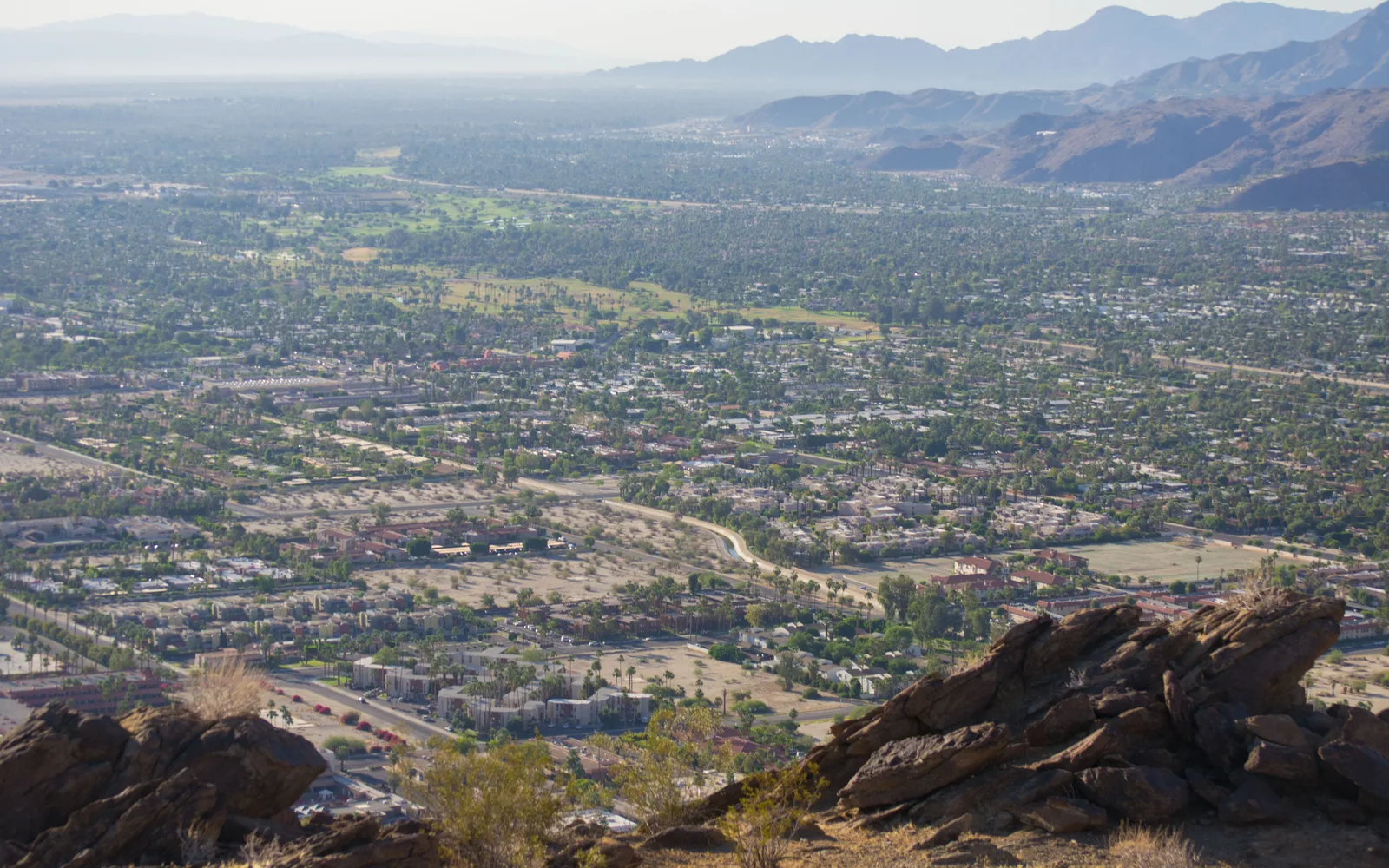 Wide view of the Coachella Valley landscape showing desert terrain and distant mountains